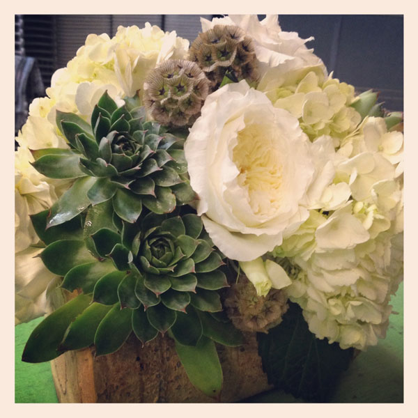 white roses, hydrangea succulents in wood base