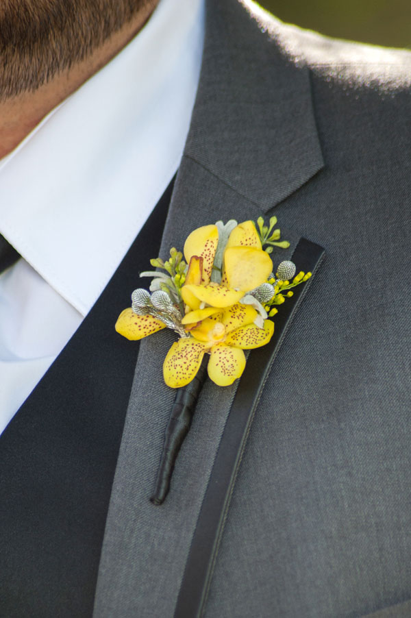 Designed by Shannon Cosgrove-Rivas of Flourish, California. 3 Yellow Aranda orchids Seeded Eucalyptus Solidaster Brezillia berry (sprayed silver) Dusty miller $18.50 (photo by Briggs Photography)