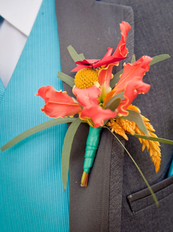 Designed by Ria of Natures Grace Design, Colorado. Gloriosa orange, craspedia, willow euc. celosia, satin ribbon, pinwheel accent $15.00