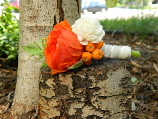 orange ranunculus boutonniere