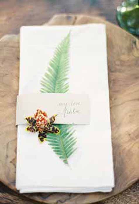 Oak & The Owl, Kurt Boomer Photography, Napkin treatment with a fern and orchid for a wedding reception.