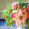 pink poinsettia and amaryllis with roses centerpiece