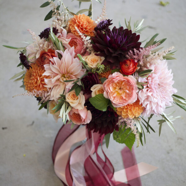 Bella Fiori in Washington. A bouquet of dahlias, garden roses, ranunculus and scabiosa flowers.