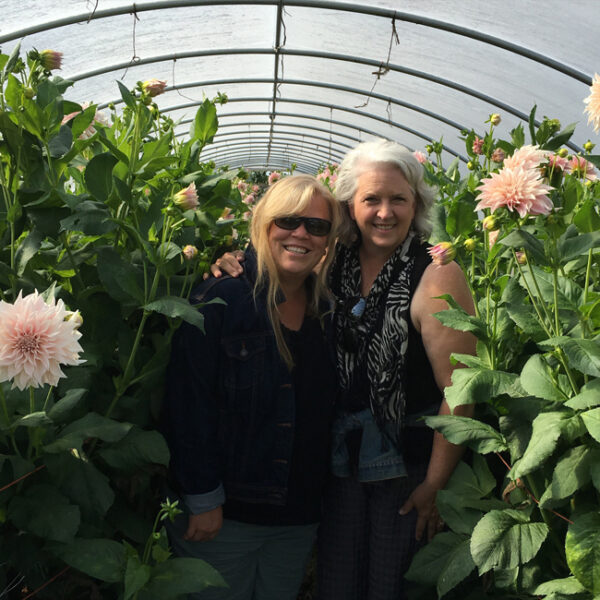 Alicia Schwede and Debra Prizing in the Cafe Au Lait Dahlia hoop house at Jello Mold Farm