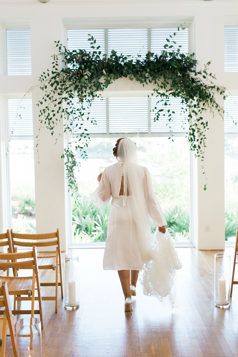 Myrtle Blue Floral Design, Florida. Shannon Griffin Photography. greenery flower arch for ceremony.