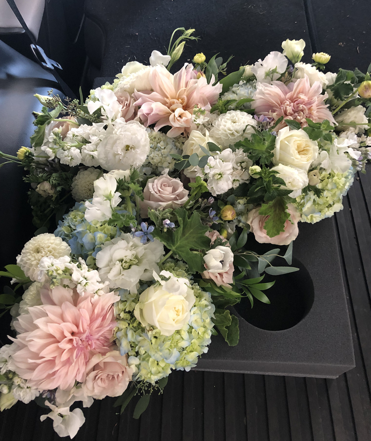 Flirty Fleurs Floral Designing, working with Deliverease to transport flowers from studio to a wedding venue
