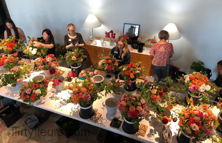 Flirty Fleurs Floral Design Class in Seattle, Washington -  students making flower centerpieces