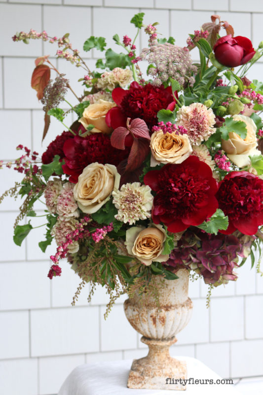 flirty fleurs large arrangement with red peonies golden mustard roses antique carnations
