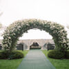 Jessica Jones Blooms N Blossoms Wedding Florist Kentucky - arch at horse farm fully decorated in white roses