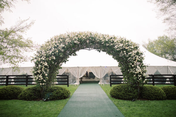 Jessica Jones Blooms N Blossoms Wedding Florist Kentucky - arch at horse farm fully decorated in white roses