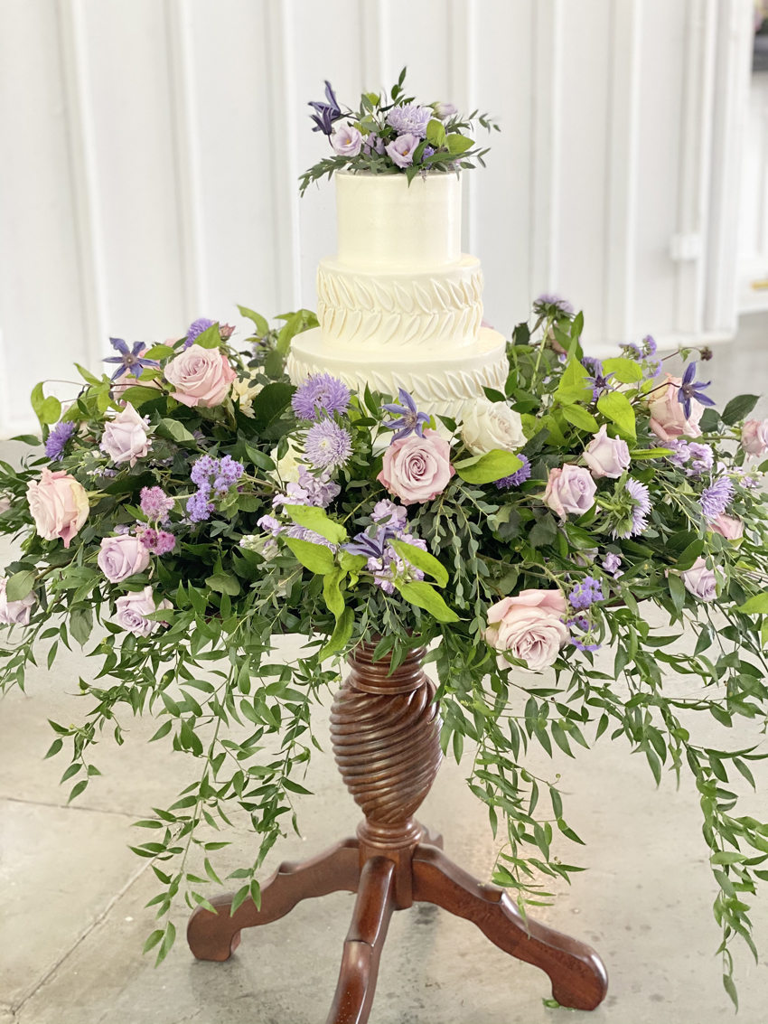 Jessica Jones Blooms N Blossoms Wedding Florist Kentucky - wedding cake surrounded by lavender flowers